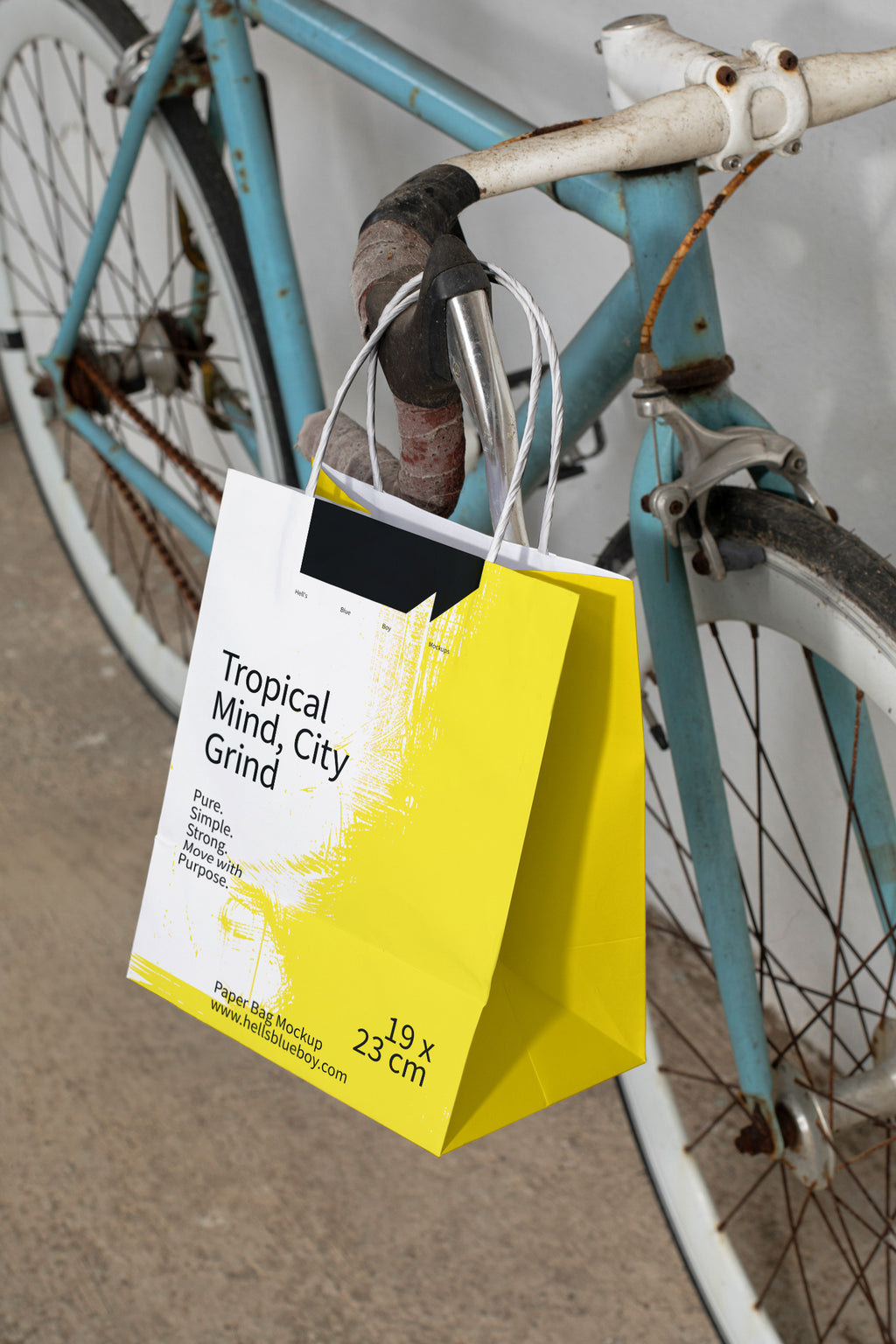 Paper bag mockup hanging on a racing bike handlebar in 80s style.