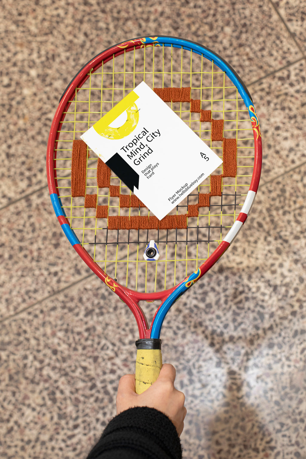 Flyer mockup placed on a tennis racket.