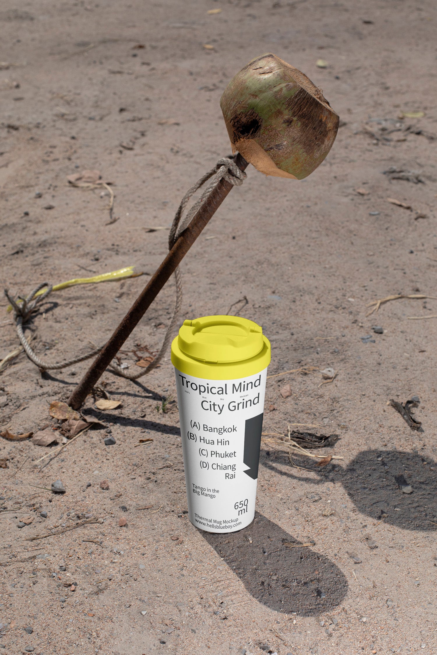 High-resolution thermal mug mockup set against a coconut and steel nail scene.
