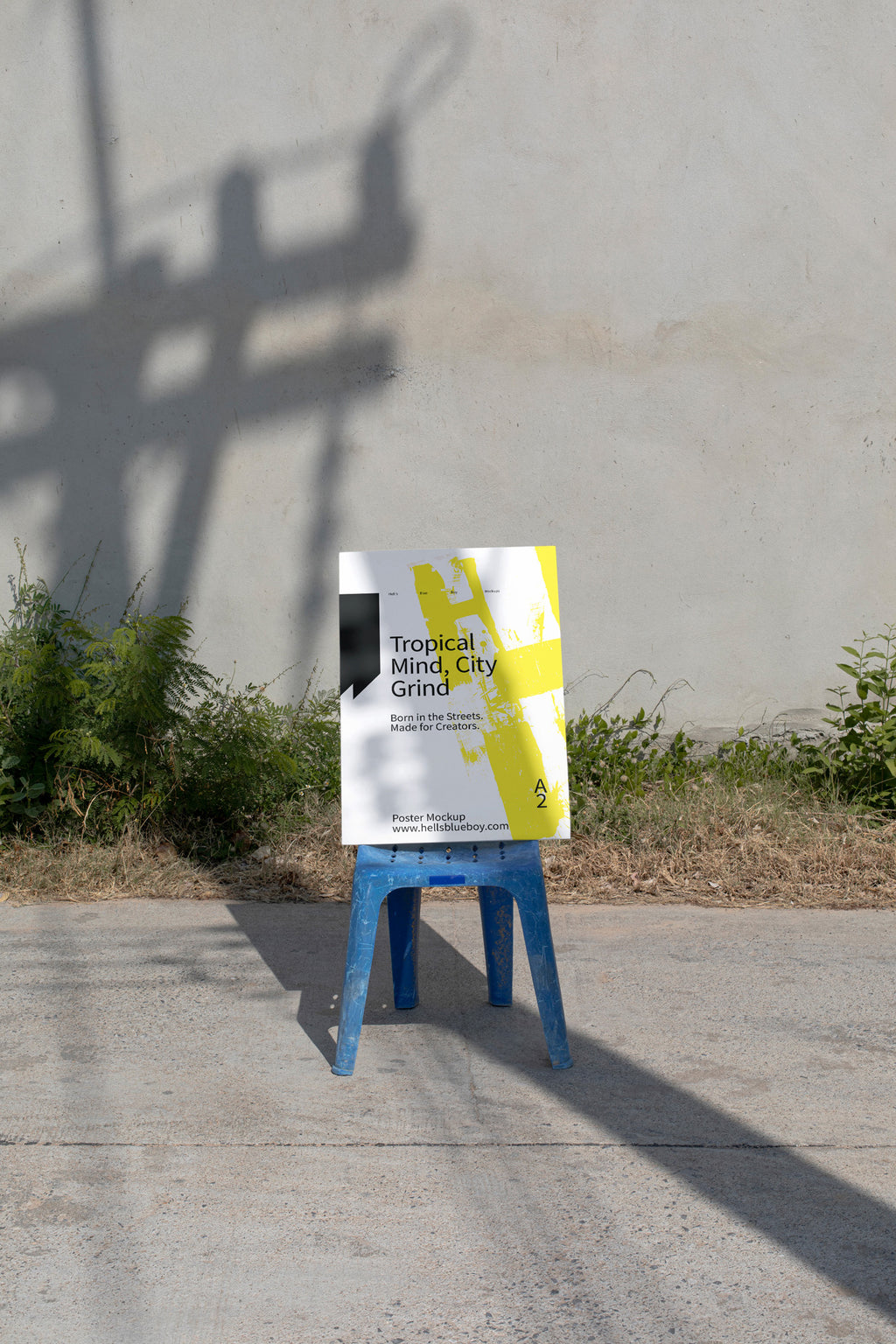 Photorealistic A2 poster mockup set on a blue chair in a rural street scene. Designed for print layouts, typography, and visual branding.