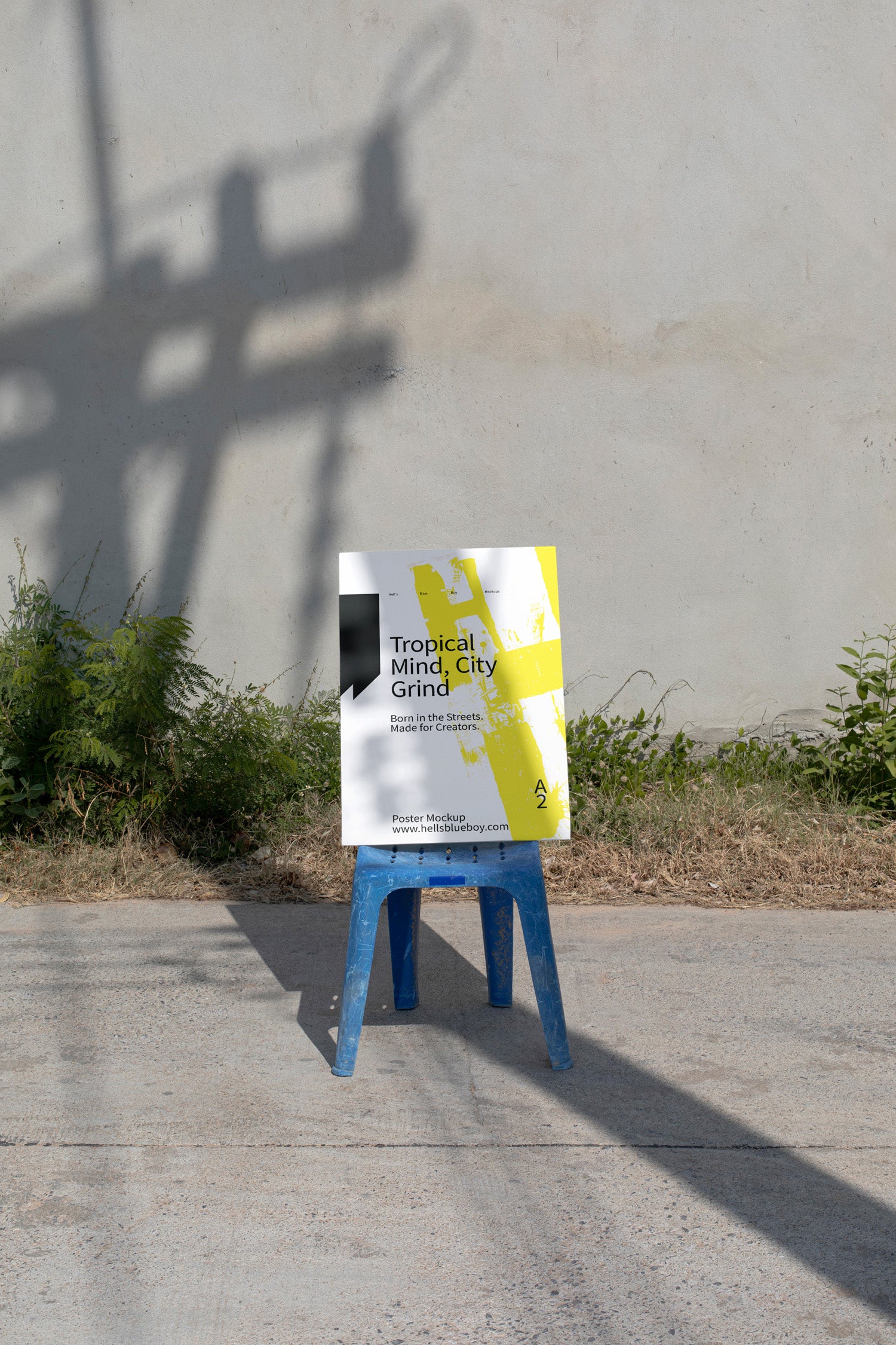 Photorealistic A2 poster mockup set on a blue chair in a rural street scene. Designed for print layouts, typography, and visual branding.