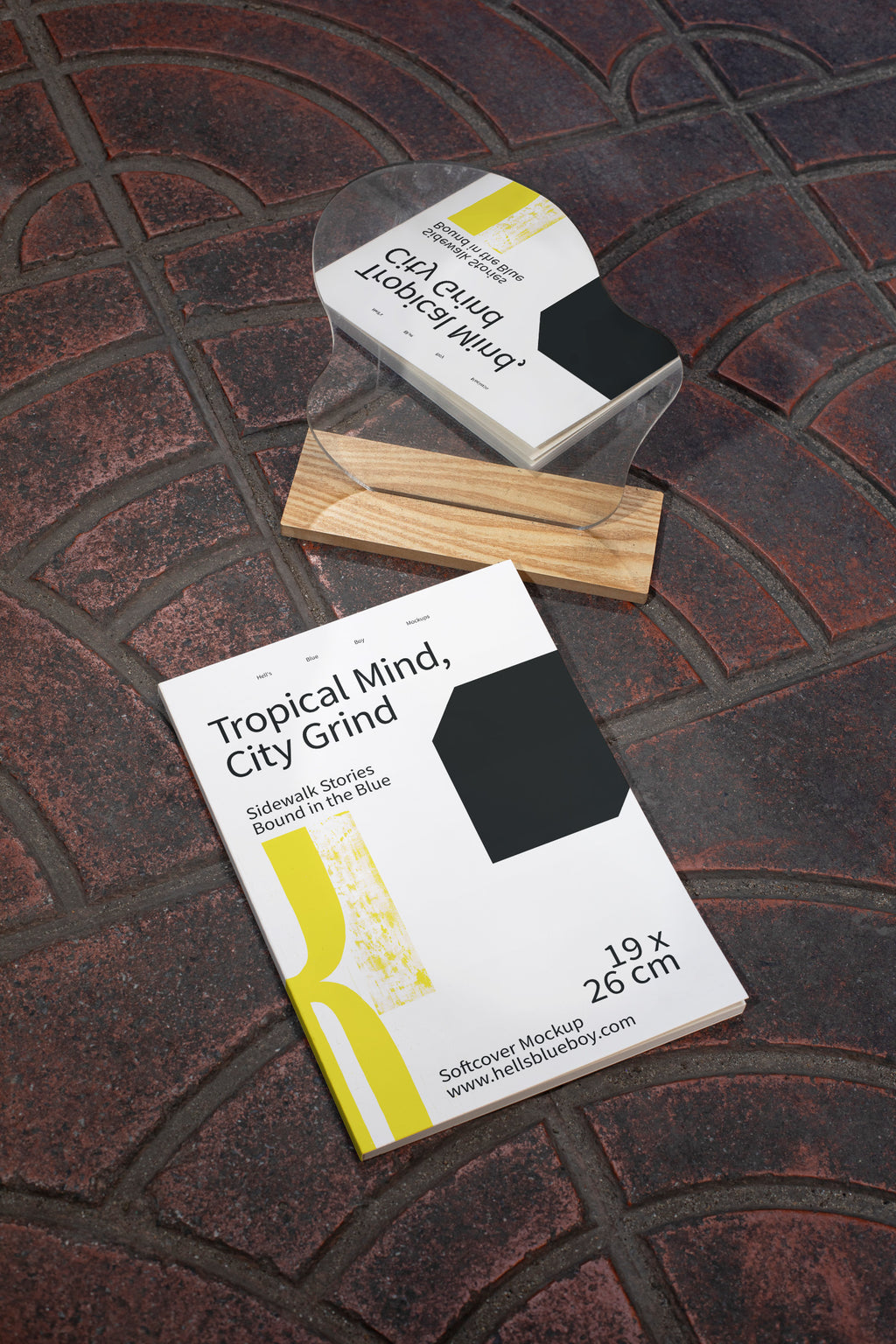 Street-inspired softcover magazine mockup with natural mirror reflection on urban tiled flooring.