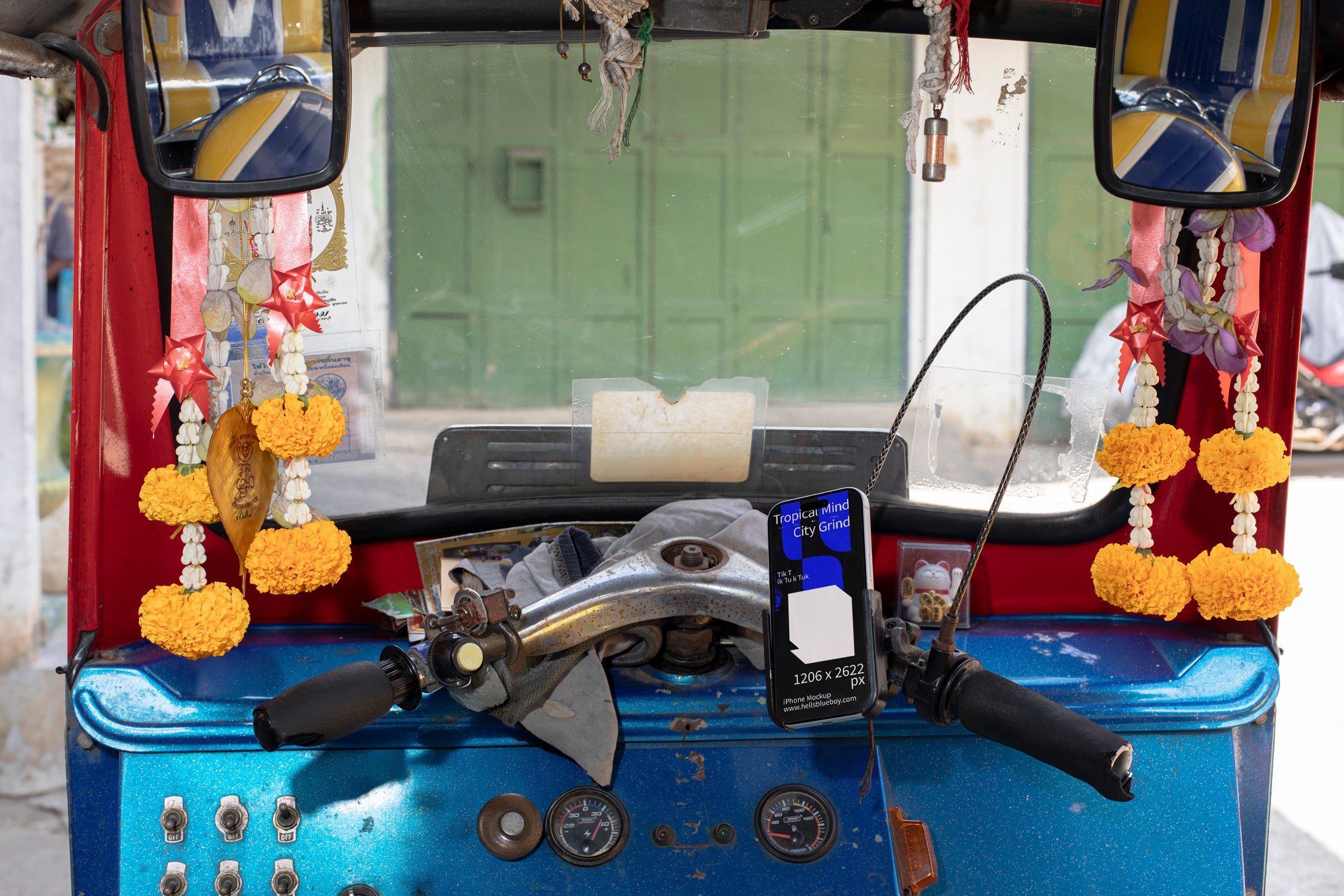 iPhone mockup placed in a mobile phone holder inside a tuk tuk.
