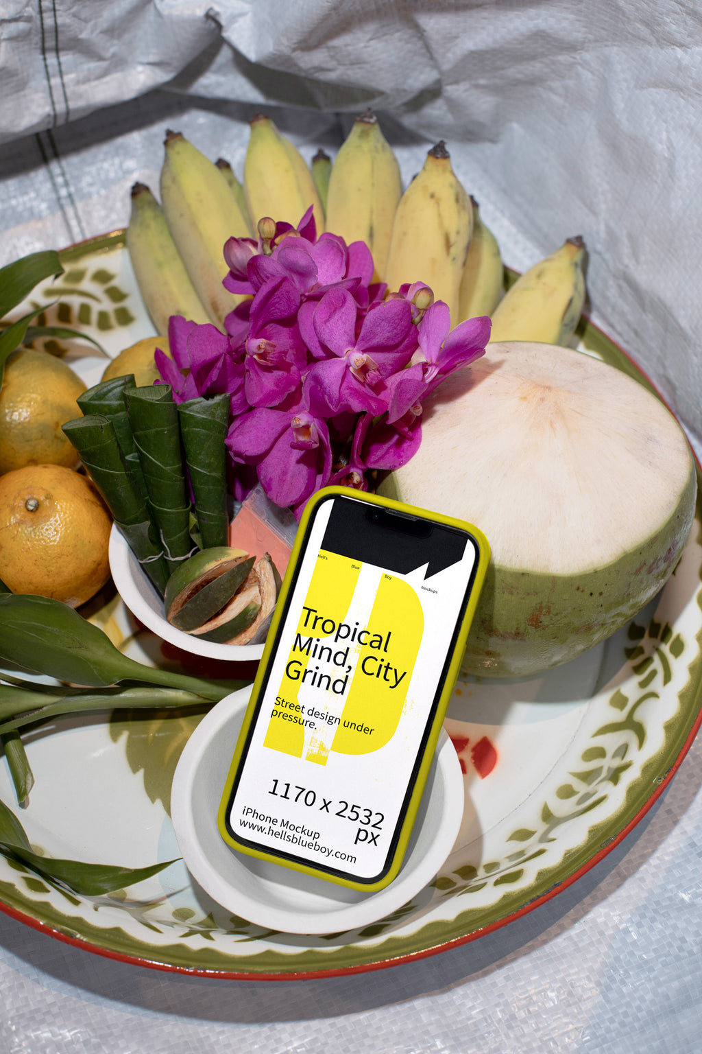 Photorealistic iPhone mockup with a rubber case placed on a traditional fruit offering. Designed for app previews, UI layouts, and digital branding.