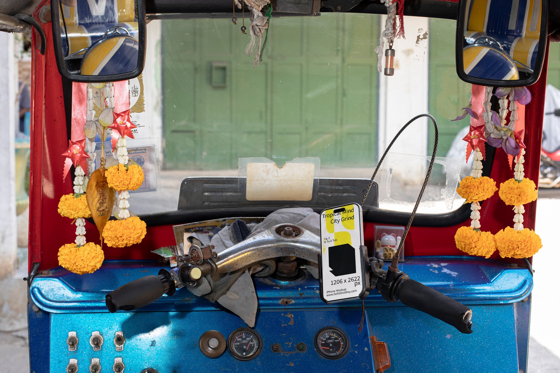 iPhone mockup placed in a mobile phone holder inside a tuk tuk.